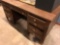 WOODEN DESK, CASE OF CUPS AND PICTURE