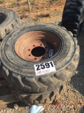 SKID STEER TIRE AND RIM,