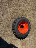 NEW 10-16.5 SKID STEER TIRE AND RIM