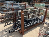 METAL RACK OF BLACK METAL FENCE POSTS AND METAL RAILING