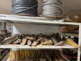 SHELF OF VARIOUS BUCKET TEETH AND SHANKS