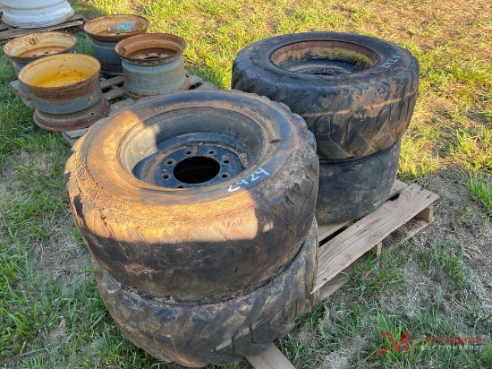 (4) 8 LUG SKID STEER TIRES & RIMS