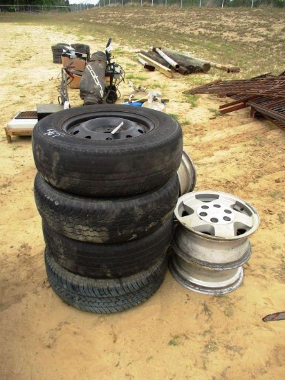 4 TIRES AND ALUM RIMS