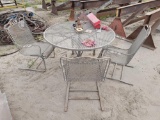 WROUGHT IRON TABLE AND 4 CHAIRS