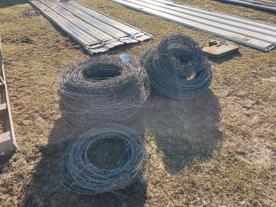 2580 - 15- LARGE 1- SMALL ROLLS OF BABRED WIRE