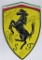 signed Ferrari shield.