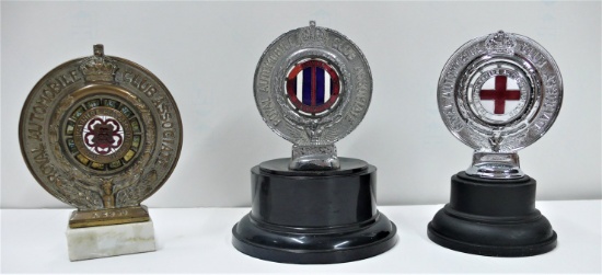 Three motoring badges.