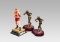 Three boxing figurines, two similar metalware figures of amateur boxers, on