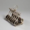 A silver plated tennis theme novelty toast rack circa 1900,  designed with