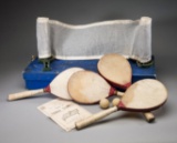 A boxed ''Cavendish'' table tennis set circa 1905, with four vellum paddles