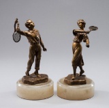 A pair of gilt-bronze figures of tennis players circa 1900, signed H. Risch