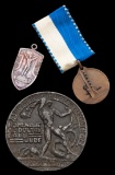 Two medals commemorating Uruguay's victory in the football tournament at th
