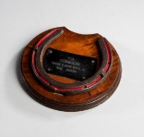 A racing plate worn by the 1891 Triple Crown winner ''Common'', the grooved