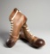 A pair of vintage 'Manfield Hotspur' football boots, in tan leather and in