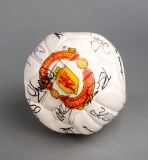 A Manchester United souvenir club football signed by the 1999 Treble Winnin