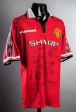 A multi-signed Manchester United 1999 Treble Winners jersey, 18 signatures