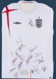 A white England football jersey signed by the touring squad to USA and Colo