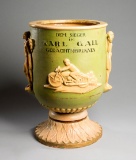 A rare continental stoneware memorial urn for the Austrian motorcycle racer