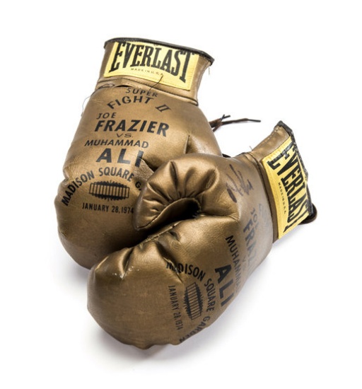 A pair of souvenir 'golden' gloves for the Joe Frazier v Muhammad Ali Fight