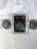 (3) silver coins, 1986 uncirculated Canadian silver dollar, Elizabeth II two pound coin and