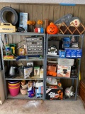 Contents of two grey shelf units in garage