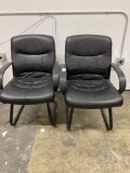 (2) Black vinyl arm chairs