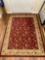 Rug 6' x 4 1/2 ' red and beige floral pattern