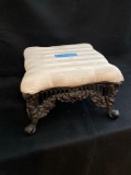 Metal foot stool with upholstered top