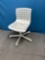 White plastic rolling chair