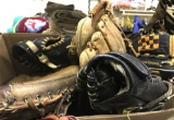 Box full of Vintage and Modern Baseball Gloves