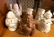 6 Buddha Figures- 1 is wood and 5 are Ceramic