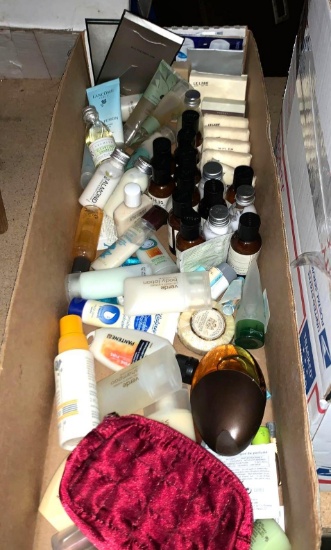 Box full of Trial Size Shampoo, Conditioner, Shower Gel and Lotion