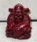Laughing Buddhist Monk Holding fish symbolizes Good Fortune