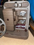 1940's Bell and Howell Movie Projector with Reel - works