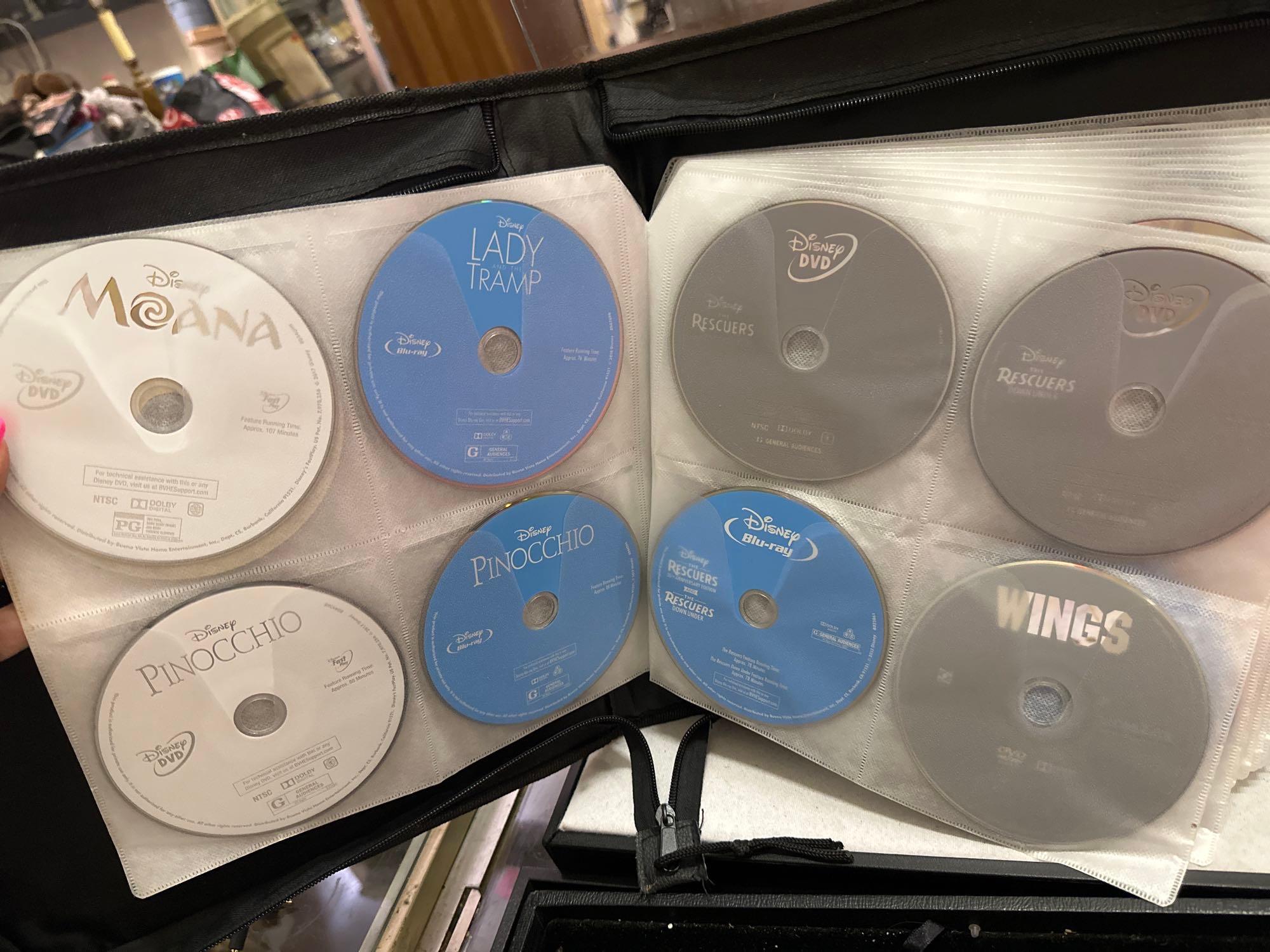 Over 110 DVDs + Blu Rays in a Binder - Disney, | Proxibid