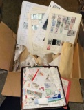 Large box of used US postage stamps- thousands including a Homemade album w/stamps