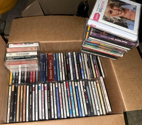 Box full of CD's and a Couple Cassette Tapes