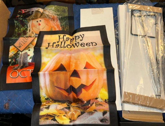 2 Brand New garden Flag Holders and 2 New Halloween Flags