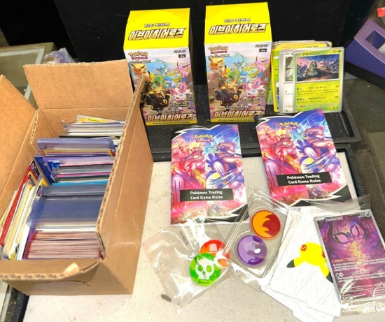 Group of Unsearched Pokemon Cards including 2 Boxes of Japanese Cards