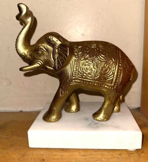 Golden Elephant on An Alabaster Stand