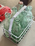 6 COCA COLA BOTTLES WITH CARRIER