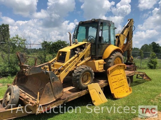 2001 New Holland 675E 4WD Loader Backhoe with 1995 Better Built 25 foot Pintle Hitch Tag A Long