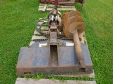 Skid loader mounted post hole auger