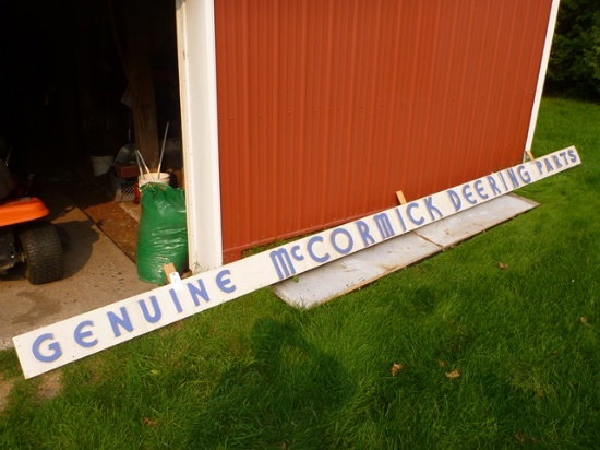 "Genuine McCormick Deering Parts" wooden sign