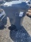 Grey plastic trash barrel