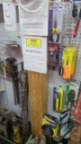 Wall contents screw drivers, hand tools, pipe