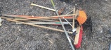 Lot of hand tools- rakes and brooms