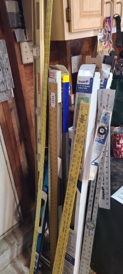 Lot of level squares and yard sticks and level