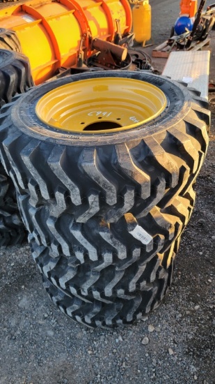 4 new 10 - 16.5 skidsteer tires and rims