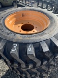 New 4- 12X16.5 skid steer tires with rims